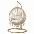 Fauteuil suspendu en rotin et acier avec coussins beige