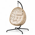 Chaise suspendue en rotin avec coussin en toile beige et base en métal